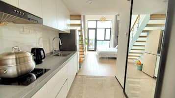Fridge, stovetop, electric kettle, cookware/dishes/utensils