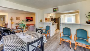 A compact living space with a dining area, kitchenette, and a small kitchen. - Grangeville Vacation Rental Near Downtown & Parks! (Grangeville)