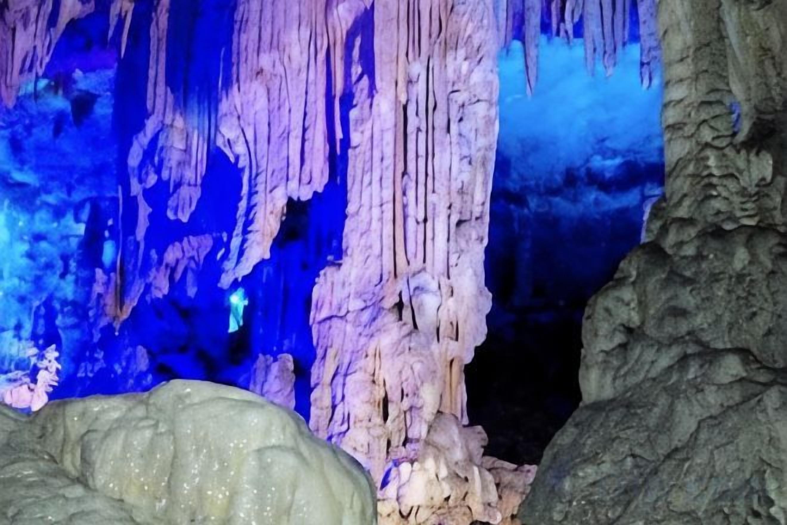 A cave interior with stalactites and stalagmites.