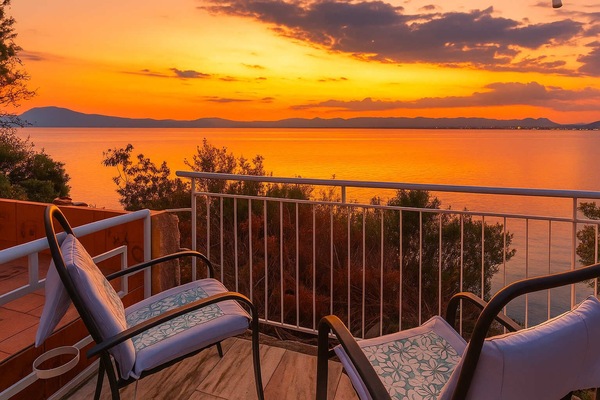 Seafront Terrace at Sunset • Wine, Waves & Golden Sky