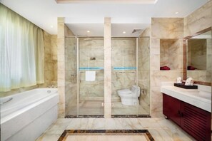 A modern bathroom with a glass-enclosed shower, a white bathtub, and a vanity with a mirror. - Xinlong Hotel (Wuhan)