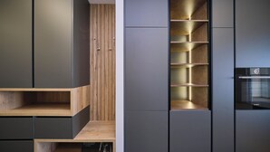 A modern kitchen with built-in appliances, wooden accents, and a minimalist design. - Tropic Night Apartment by Litto (Split)