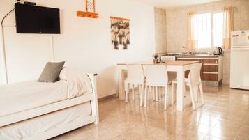 Family Apartment | Living area | 32-inch LED TV with satellite channels