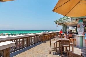 Outdoor dining - Silver Shells St Lucia 503 – Beachfront, Hot Tub + Community Pool, Playground! (Destin)