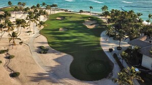 A golf course with a view of the ocean.