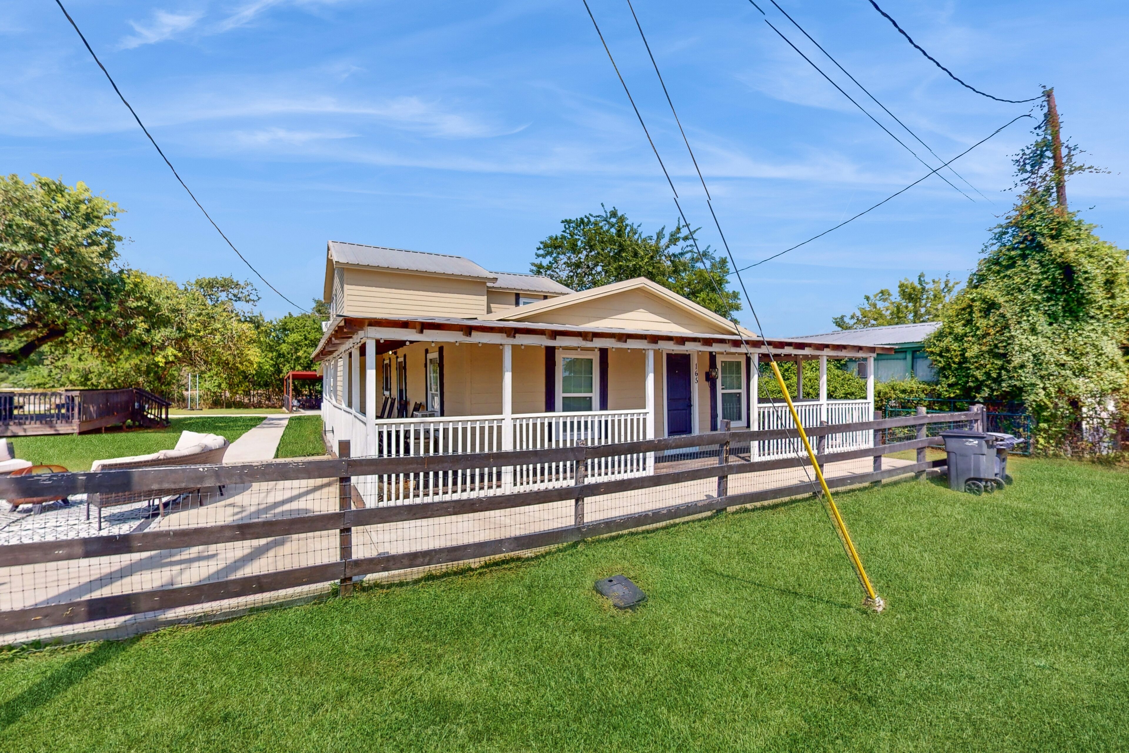 Spacious house with firepit, wraparound porch, pavilion + dog friendly