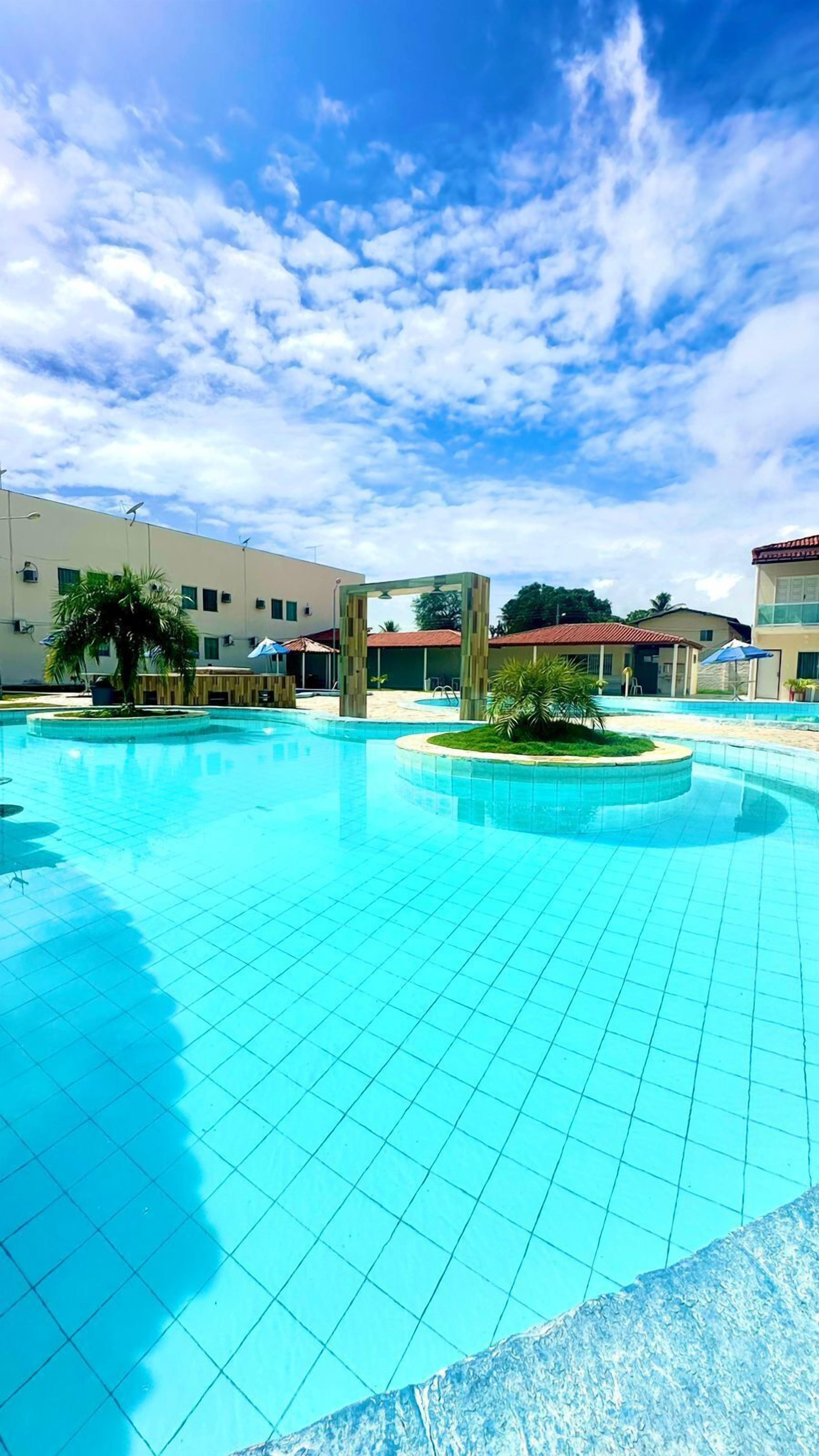 3 indoor pools, 3 outdoor pools, open 8:00 AM to 8:00 PM, pool umbrellas