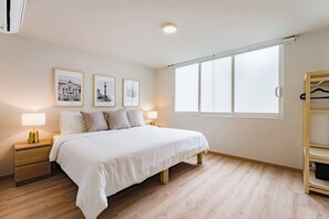 1 bedroom, desk, iron/ironing board, travel crib