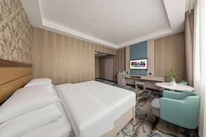 A hotel room with a bed, a desk, a chair, and a television. - Qiyu Hotel (Burqin)