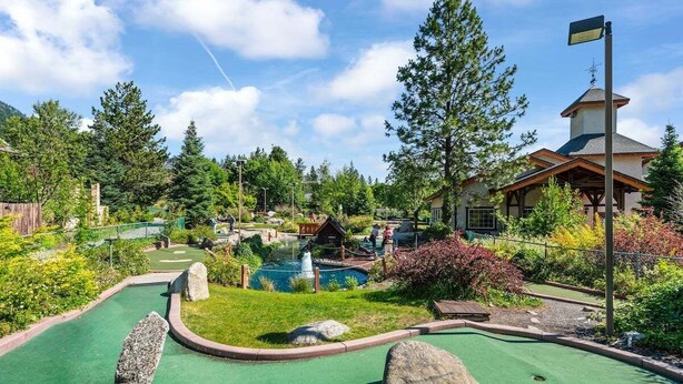 A miniature golf course with a pond, rocks, and a small building. - Leavenworth Condo - 1BR w/ Jetted Tub + Pool (Leavenworth)