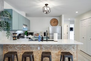 Fridge, microwave, oven, stovetop - Charming and sleek, first floor, great location!  Stocked kitchen and fireplace. (Leavenworth)