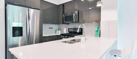 Coffee/tea maker, fridge, microwave, oven