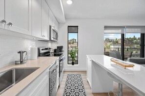 Fridge, microwave, oven, stovetop - Walk to Saddledome| Cgy Tower View | Rooftop Patio (Calgary)