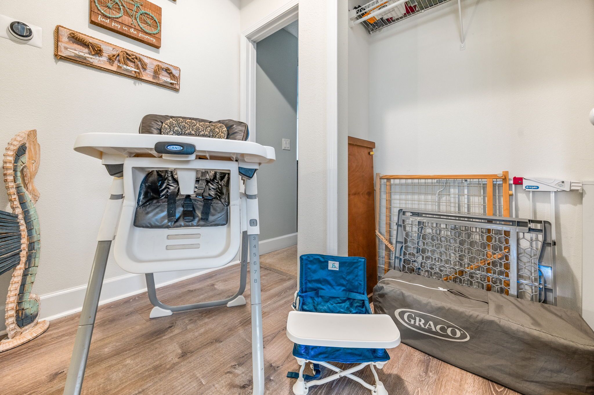 A dental office with a dental chair, a blue portable chair, and a Graco mattress.