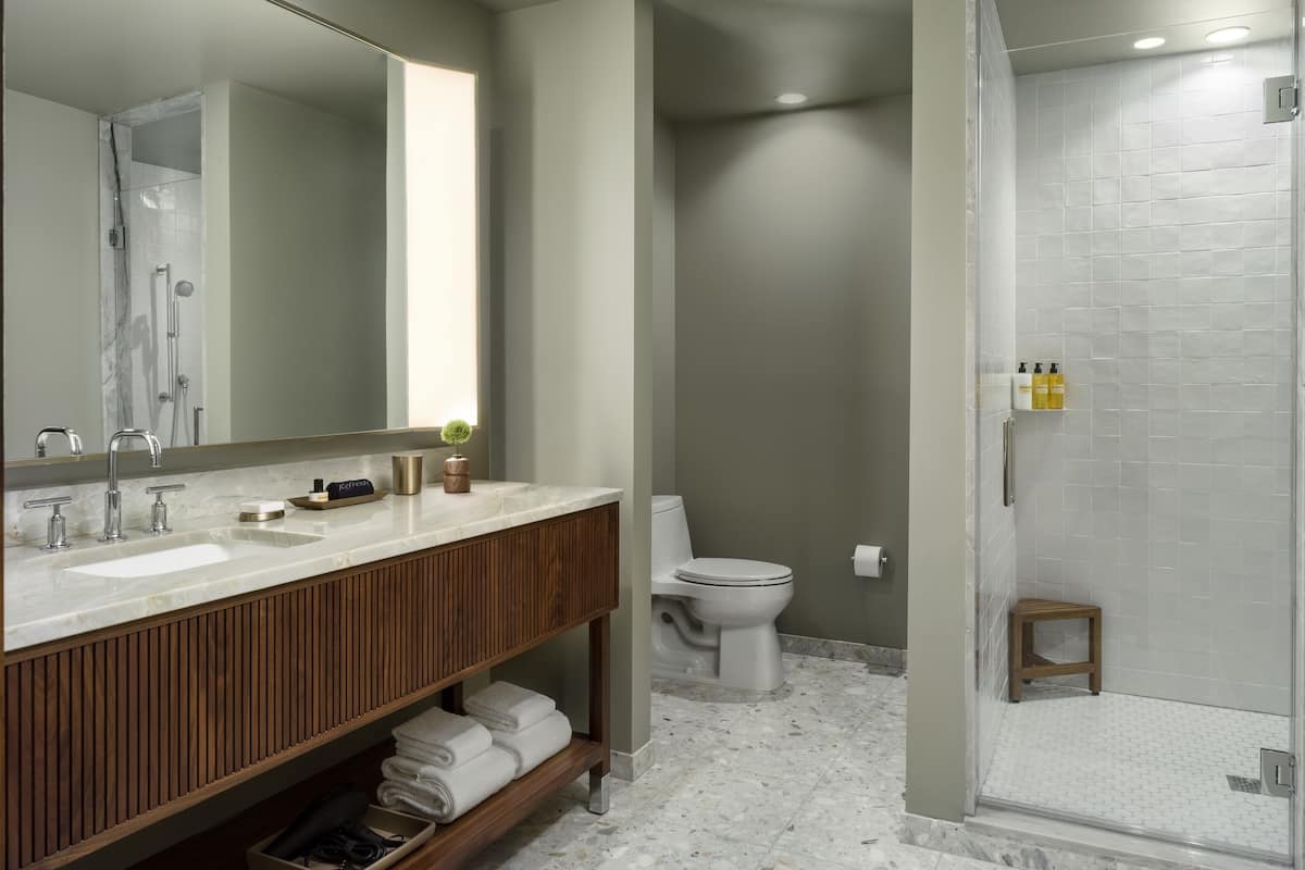 Designer toiletries, hair dryer, bathrobes, slippers