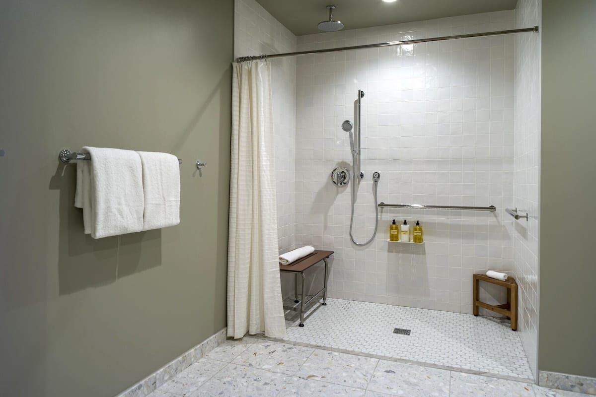 Designer toiletries, hair dryer, bathrobes, slippers