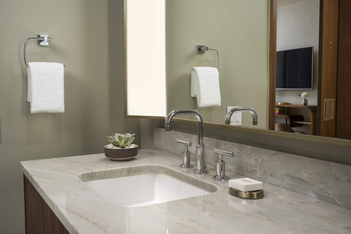 Designer toiletries, hair dryer, bathrobes, slippers