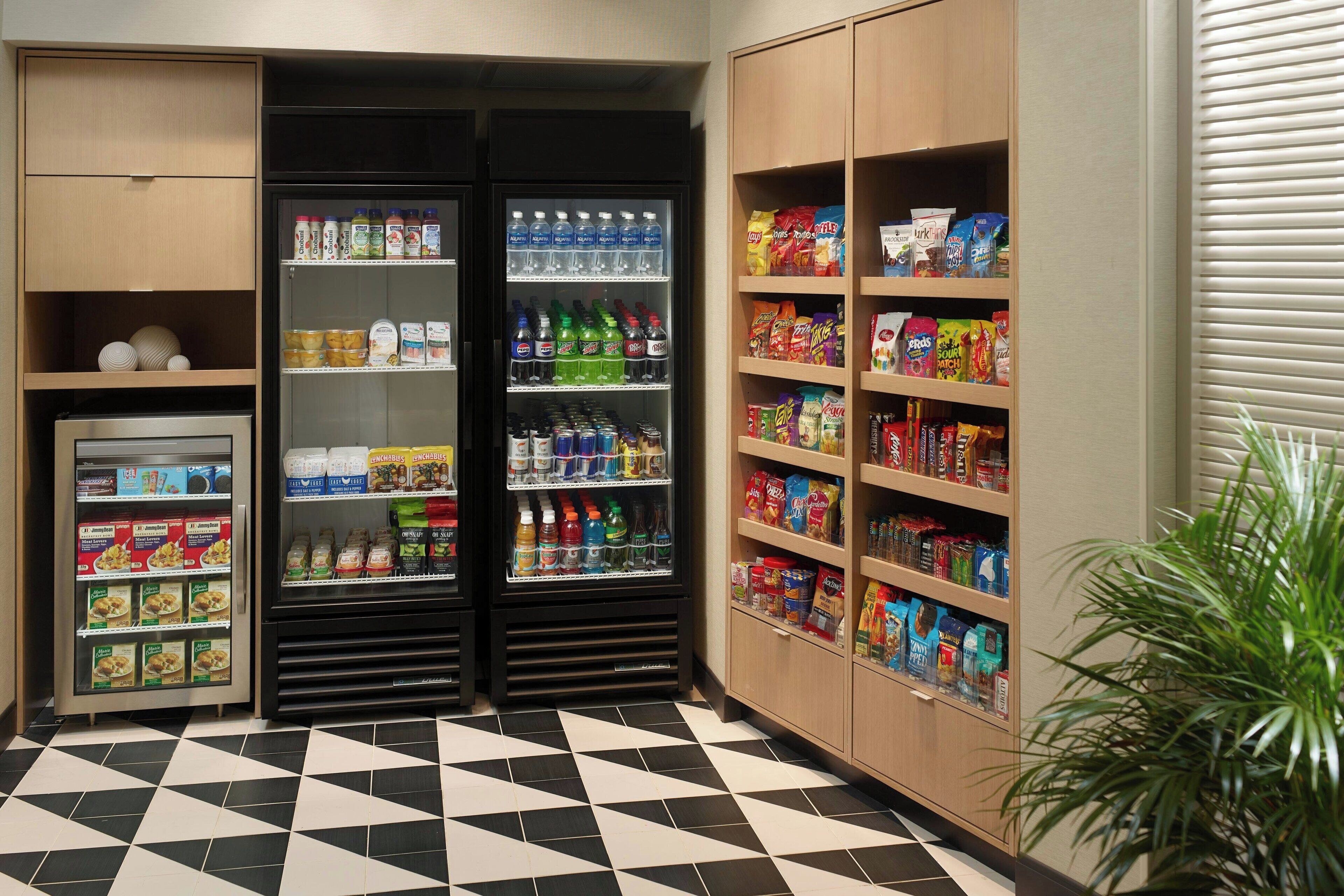 A vending area with various food and drink options, including snacks, beverages, and packaged goods.