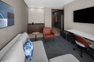 Suite, 1 Bedroom | Desk, laptop workspace, blackout drapes, iron/ironing board