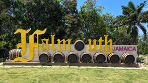 A large sign with the words "Falmouth Jamaica" and a series of barrels. - Charming 1-bedroom house with AC, WiFi in welcoming Falmouth (Falmouth)