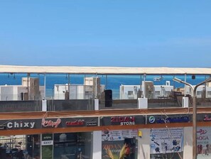 A coastal view with a restaurant named 'Chixy' and a store named 'Zidan Store' visible. - An elegant seafront apartment (Hurghada)