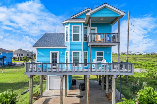 Vibrant blue exterior with spacious decks for sunbathing and scenic views!