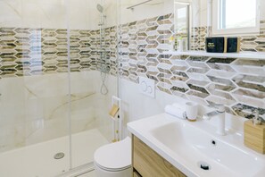Shower, hair dryer, towels, soap