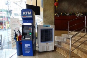 An ATM machine and a portable air conditioner in a public indoor space. - Chinatown Lai Lai Hotel Manila (City of Manila)