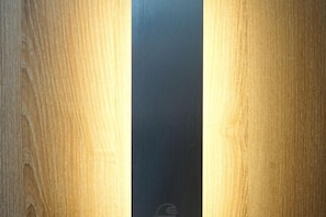 A wooden surface with a vertical black stripe.