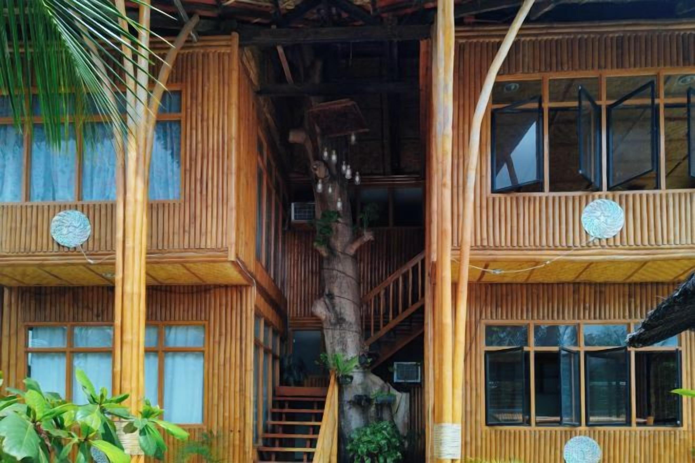 A multi-story wooden building with a staircase connecting the floors.
