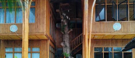 A multi-story wooden building with a staircase connecting the floors.