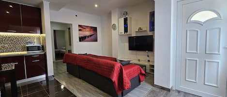 Comfort Apartment, 2 Bedrooms, Non Smoking, Kitchen | Living area | 55-inch Smart TV with cable channels