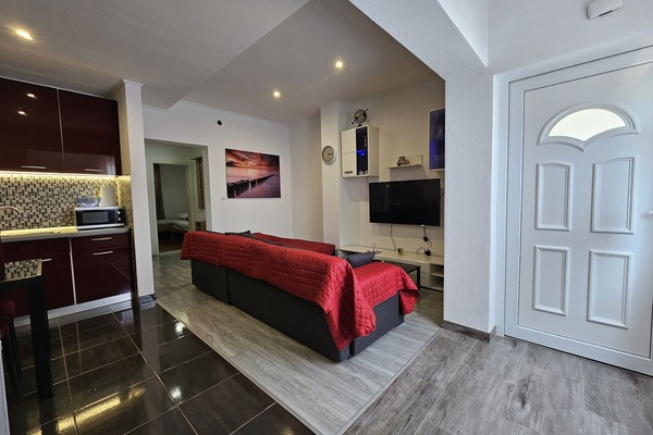 Comfort Apartment, 2 Bedrooms, Non Smoking, Kitchen | Living area | 55-inch Smart TV with cable channels