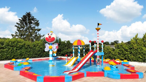 A water park with a clown statue, slides, and a pool. - Gorgeous home in Merksplas (Merksplas)