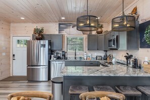 Fridge, microwave, oven, stovetop - Luxury and comfort at 'Abide', a spacious 3-bd cabin in Pigeon Forge perfect for up to 12 guests. (Pigeon Forge)
