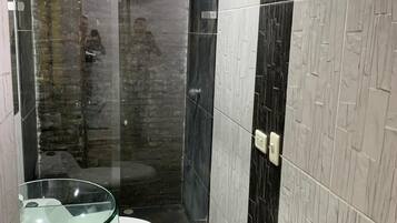 Shower, towels, soap, toilet paper