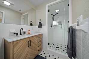 Shower, hair dryer, towels, soap