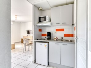 Microwave, stovetop, highchair, cookware/dishes/utensils