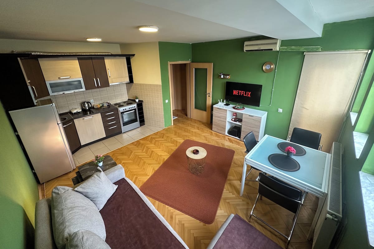 Apartment, City View | Living area | 55-inch LCD TV with cable channels