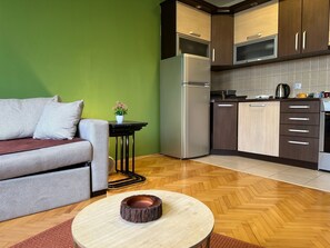 Apartment, City View | Living area | 55-inch LCD TV with cable channels