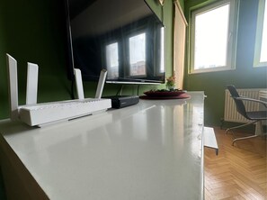 Apartment, City View | Living area | 55-inch LCD TV with cable channels