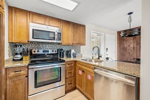 Coffee/tea maker, fridge, microwave, oven