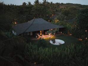 A house with a covered patio, surrounded by dense vegetation. - Kuara Lombok - Adults Only Boutique Resort (Mertak)
