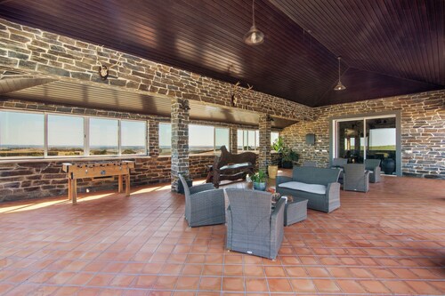 Room 'Quarto Cinzento - Field View - With Patio' with Shared Pool, Wi-Fi and Air Conditioning