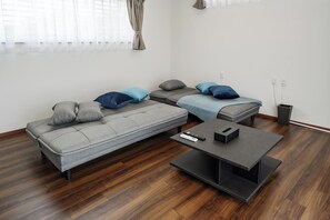 Comfort House, Garden View | Living area | 50-inch LCD TV with digital channels