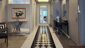 A modern hallway with a geometric patterned carpet, recessed ceiling lighting, and a view into a bedroom. - Nice Decorated townhouse in local neighborhood, 10 minutes walk to BTS (Thunburi)