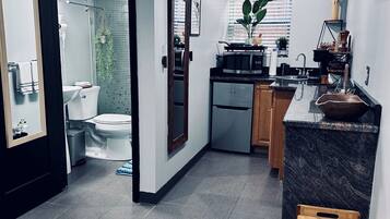 Fridge, microwave, coffee/tea maker, cookware/dishes/utensils