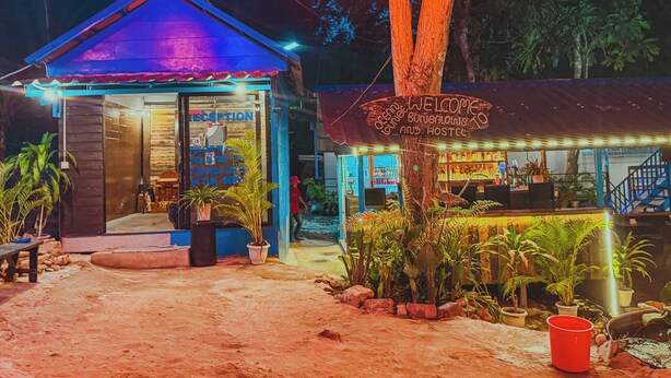 A reception area with a sign reading "Welcome to Ocean Lounge Bungalows and Hostel." - Blue Shore Pavilion (Koh Rong)