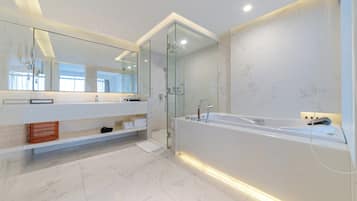 Deluxe Suit Room | In-room safe, desk, laptop workspace, iron/ironing board
