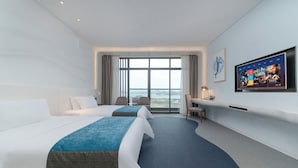 A hotel room with two beds, a desk, a TV, and a large window with a view. - CZD HOTEL (Shenzhen)